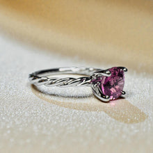 Load image into Gallery viewer, May include: A silver ring with a twisted band and a heart-shaped pink gemstone. The gemstone is set in a four-prong setting, and the ring is displayed on a neutral background. James Allen 14K Gold Pink Sapphire Diamond Ring | Natural Pink Sapphire Engagement Ring | Romantic Fine Jewelry | White Gold | Feminine Ring