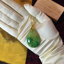 Load image into Gallery viewer, May include: A gold chain necklace with a green gemstone pendant. The pendant is a teardrop shape with a faceted cut. The necklace is displayed on a white glove. Retro South African Emerald Teardrop Necklace - 14K Yellow Gold Natural Hand Cut Faceted Estate Pendant - 20" Rope Chain - 18g Fine Jewelry
